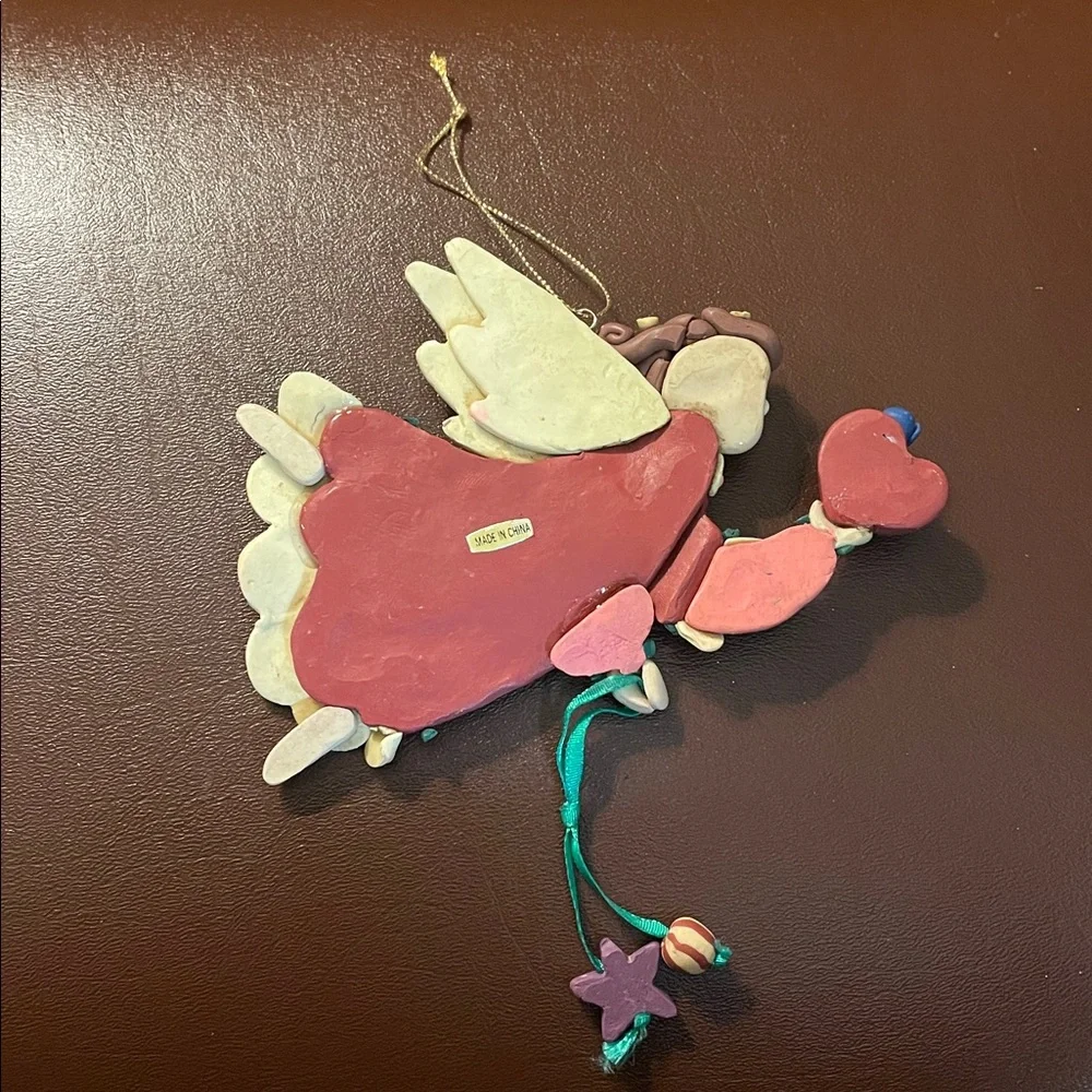 Flying Angel holding a heart Christmas ornament